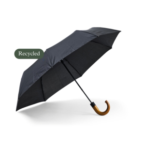 A sturdy compact umbrella with a strong wooden crutch. The frame in metal and graphite/fiberglass rods at the very ends make the construction more resistant to winds. The panels are reversible. The umbrella has automatic folding and a three-part black steel shaft.